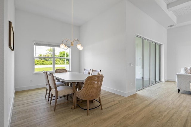 1 Clementon Ln, Palm Coast, FL 32137 - dining area with light wood-type flooring, a chandelier, and beam ceiling