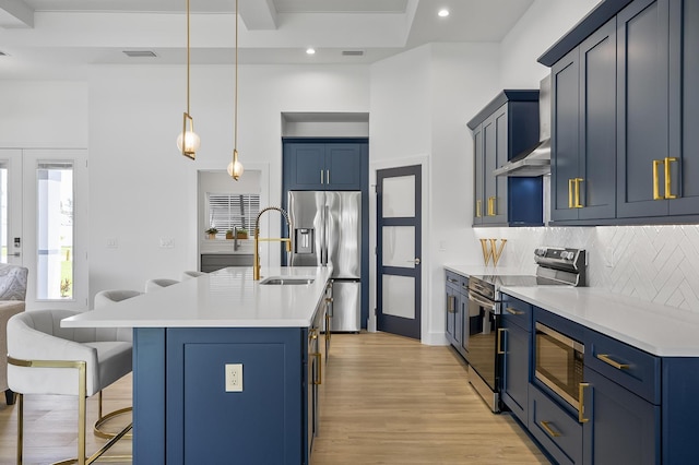 1 Clementon Ln, Palm Coast, FL 32137 - kitchen with stainless steel appliances, blue cabinetry, a breakfast bar, tasteful backsplash, and recessed lighting