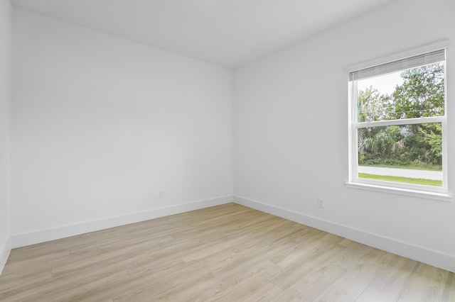 1 Clementon Ln, Palm Coast, FL 32137 - unfurnished room with baseboards and light wood-style floors