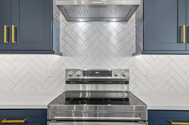 1 Clementon Ln, Palm Coast, FL 32137 - kitchen with stainless steel electric stove, ventilation hood, blue cabinets, decorative backsplash, and light countertops
