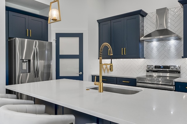 1 Clementon Ln, Palm Coast, FL 32137 - kitchen with wall chimney range hood, stainless steel appliances, blue cabinetry, decorative backsplash, and a kitchen bar