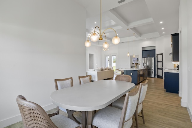 1 Clementon Ln, Palm Coast, FL 32137 - dining space featuring coffered ceiling, beamed ceiling, light wood finished floors, and recessed lighting