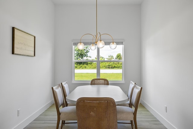 1 Clementon Ln, Palm Coast, FL 32137 - dining room with light wood-style flooring and a chandelier
