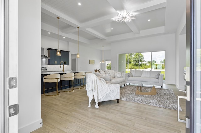 1 Clementon Ln, Palm Coast, FL 32137 - living room with beamed ceiling, coffered ceiling, recessed lighting, light wood-style flooring, and a towering ceiling
