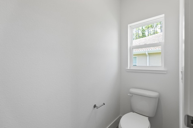 1 Clementon Ln, Palm Coast, FL 32137 - bathroom with toilet and baseboards