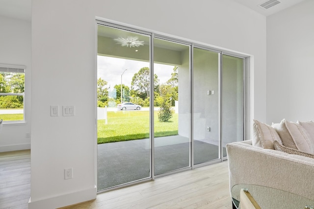 1 Clementon Ln, Palm Coast, FL 32137 - doorway to outside with light wood-style flooring