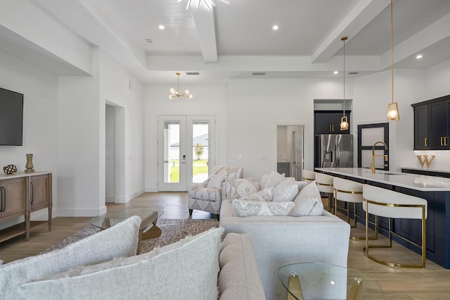 1 Clementon Ln, Palm Coast, FL 32137 - living area featuring beam ceiling, a towering ceiling, light wood-style flooring, recessed lighting, and a chandelier