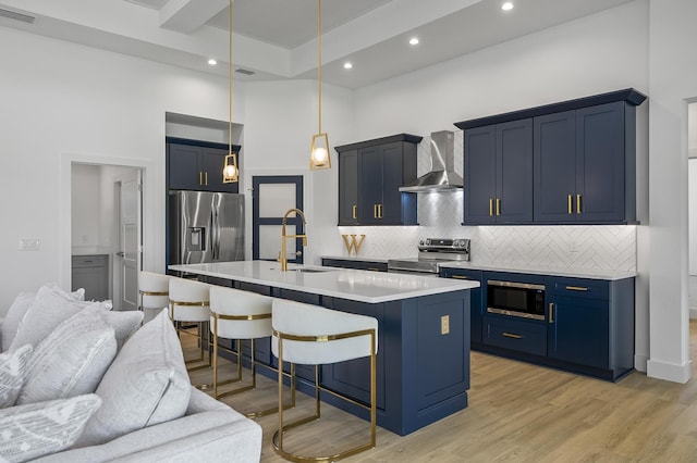 1 Clementon Ln, Palm Coast, FL 32137 - kitchen with wall chimney range hood, stainless steel appliances, open floor plan, a towering ceiling, and a breakfast bar