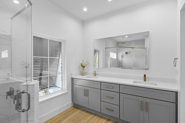 1 Clementon Ln, Palm Coast, FL 32137 - bathroom with double vanity, a stall shower, wood finished floors, and recessed lighting