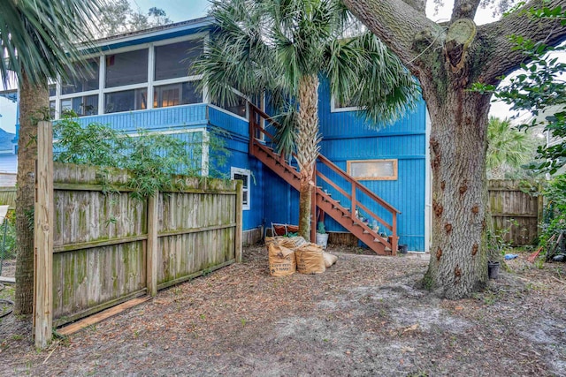 back of property featuring a sunroom