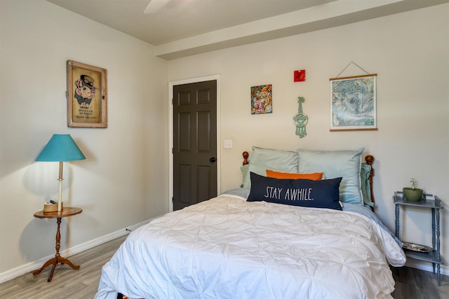 bedroom featuring ceiling fan and wood-type flooring