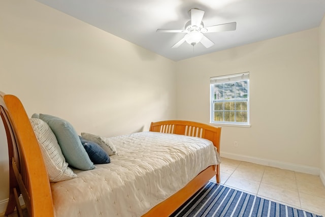 bedroom with light tile patterned floors and ceiling fan