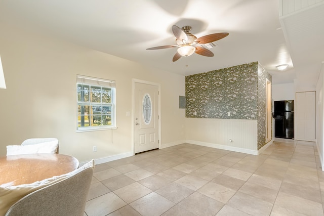 entrance foyer featuring ceiling fan and light tile patterned flooring