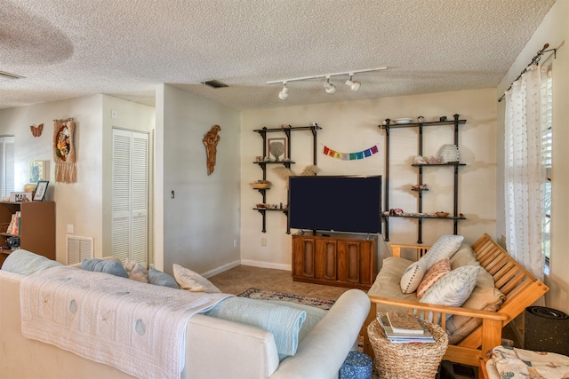 living room featuring a textured ceiling