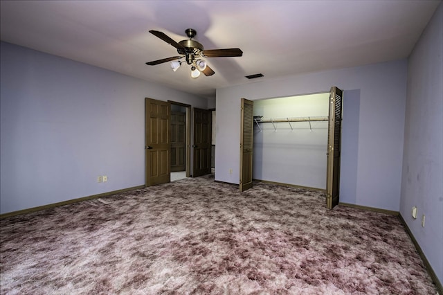 unfurnished bedroom with ceiling fan, a closet, and carpet