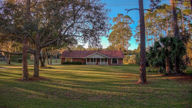 single story home with a front yard