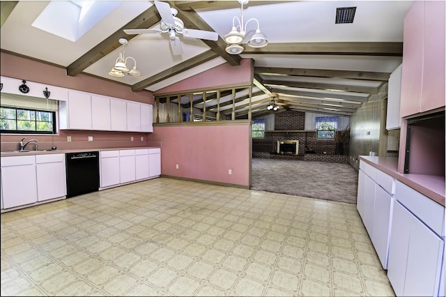 kitchen with white cabinets, pendant lighting, ceiling fan with notable chandelier, and black dishwasher