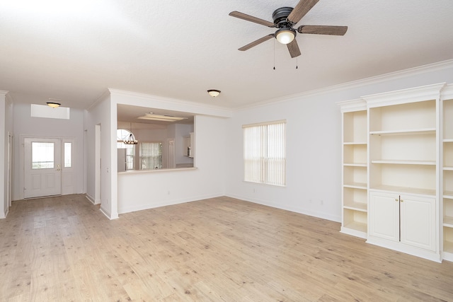 unfurnished living room with ceiling fan, light hardwood / wood-style floors, ornamental molding, and a textured ceiling