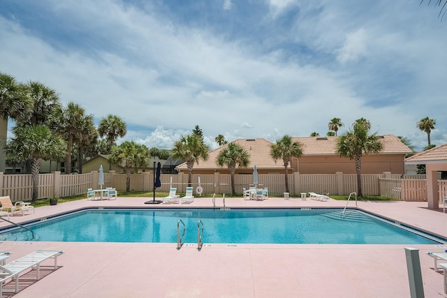 view of swimming pool with a patio