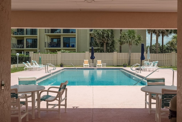 view of swimming pool featuring a patio area