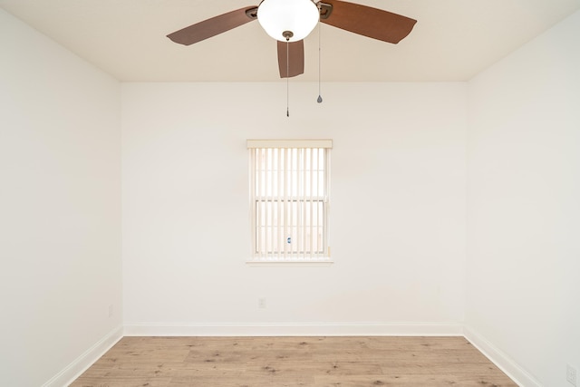 spare room featuring ceiling fan and light wood-type flooring