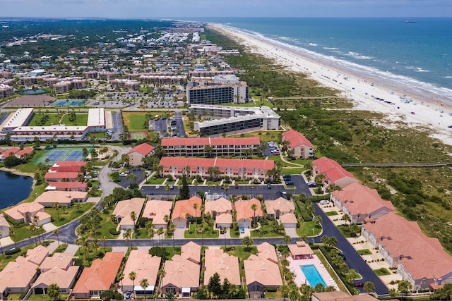 bird's eye view with a water view and a view of the beach