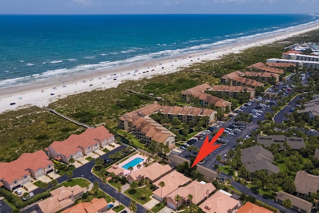 bird's eye view featuring a beach view and a water view