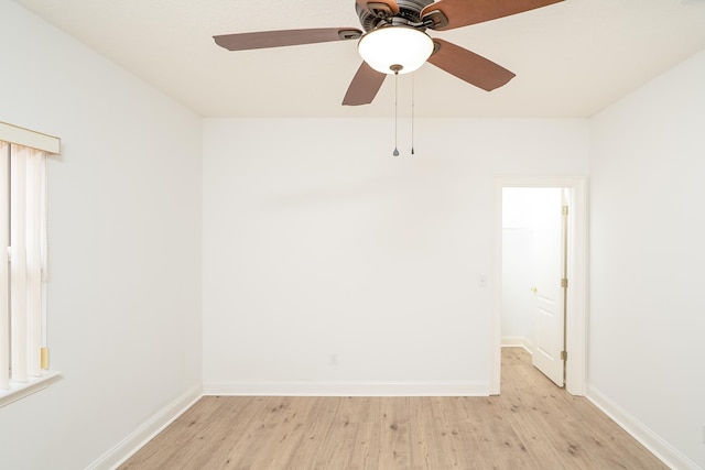 empty room with light hardwood / wood-style flooring and ceiling fan