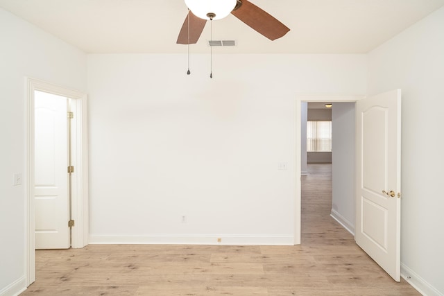 spare room featuring ceiling fan and light wood-type flooring