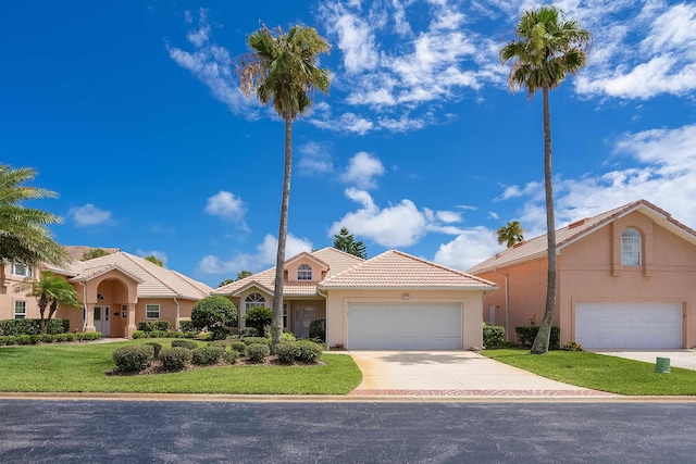 mediterranean / spanish-style house with a front lawn