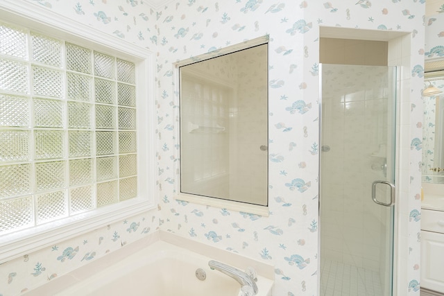 bathroom featuring separate shower and tub