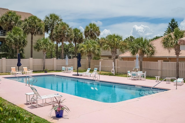 view of swimming pool featuring a patio area