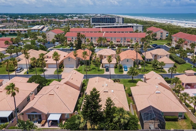 aerial view with a beach view and a water view