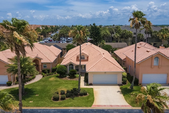 exterior space featuring a front yard and a garage