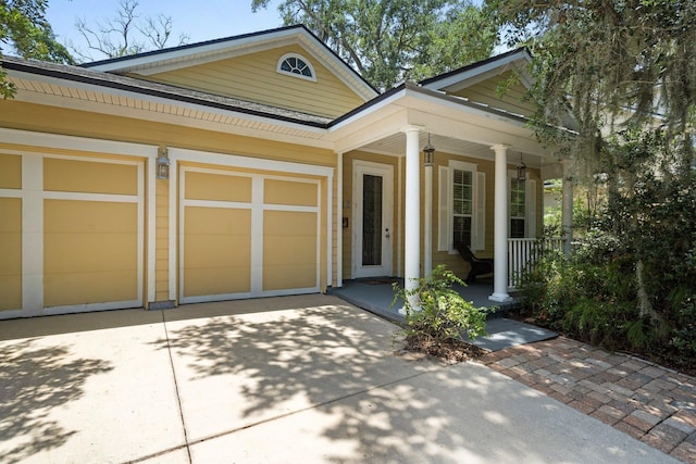 view of front of home with a garage and covered porch