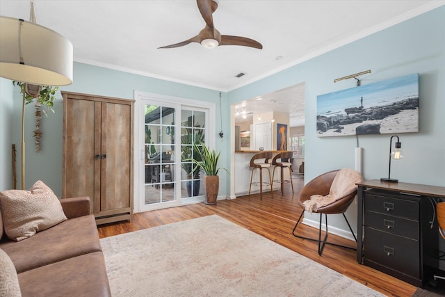 605 A St, Saint Augustine, FL 32080 - sitting room with wood finished floors, crown molding, and a ceiling fan