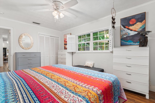 605 A St, Saint Augustine, FL 32080 - bedroom with dark wood-style flooring, ornamental molding, a ceiling fan, and a closet