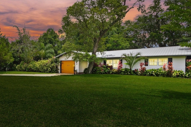 605 A St, Saint Augustine, FL 32080 - single story home with a yard, concrete driveway, a garage, and a metal roof