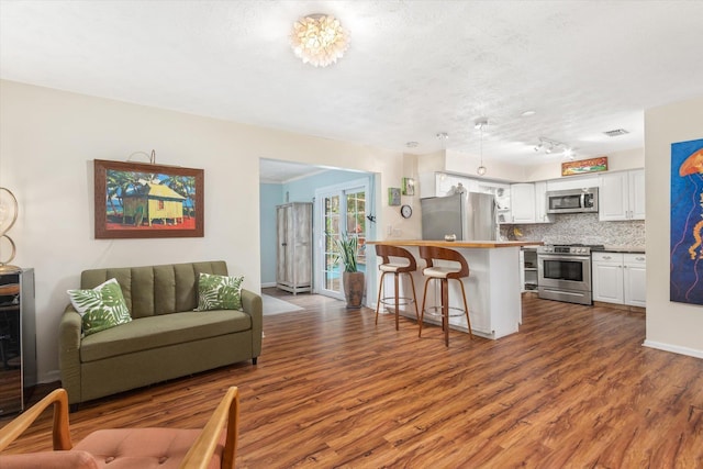 605 A St, Saint Augustine, FL 32080 - living area featuring dark wood-style floors