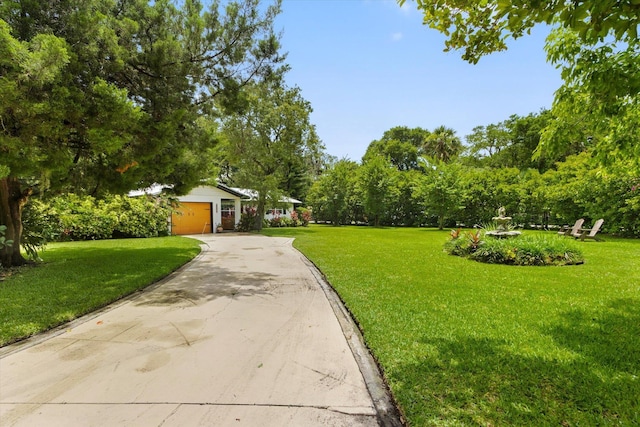 605 A St, Saint Augustine, FL 32080 - view of front of home with a front lawn, asphalt driveway, and a garage