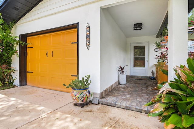 605 A St, Saint Augustine, FL 32080 - doorway to property with a garage and stucco siding