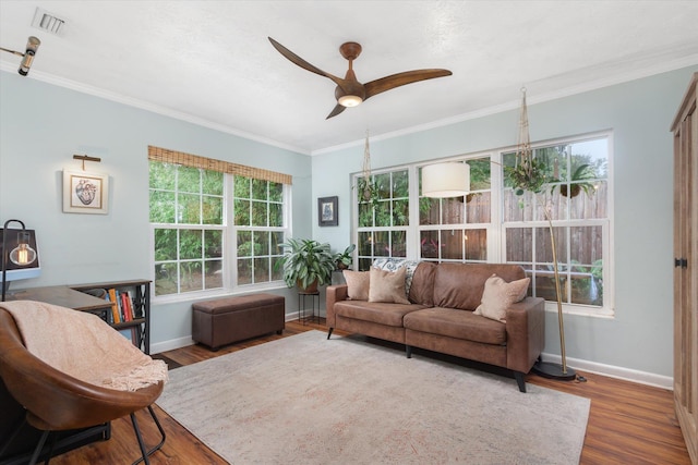 605 A St, Saint Augustine, FL 32080 - living area featuring a ceiling fan, wood finished floors, healthy amount of natural light, and crown molding