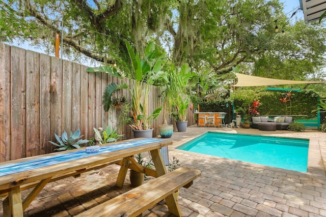 605 A St, Saint Augustine, FL 32080 - view of swimming pool with a patio area, a fenced backyard, outdoor dining area, and an outdoor hangout area