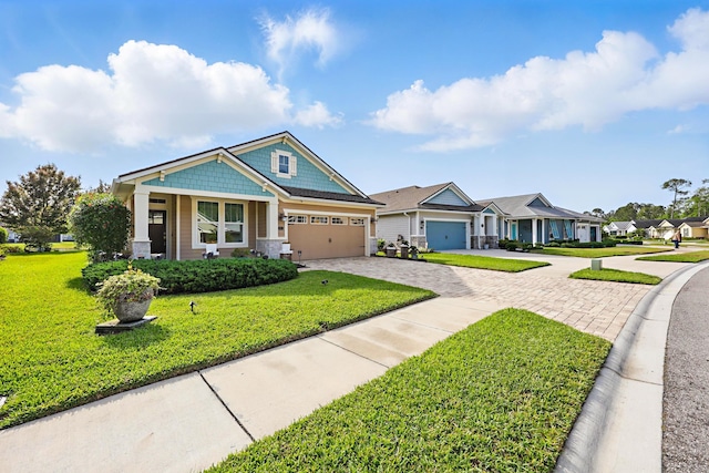 craftsman-style house featuring a residential view, a porch, a garage, a front yard, and decorative driveway