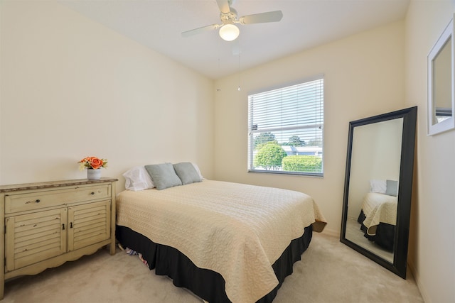 bedroom featuring ceiling fan and light colored carpet