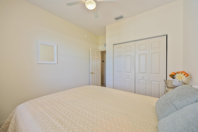 bedroom featuring ceiling fan, a closet, and visible vents