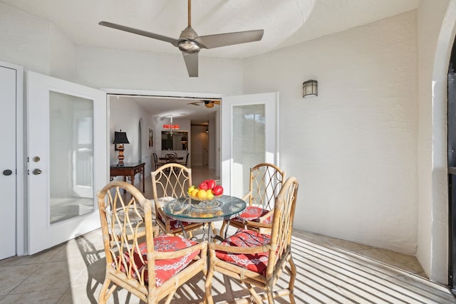 tiled dining room featuring ceiling fan