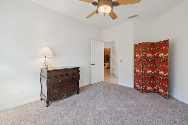 bedroom with ceiling fan and light carpet