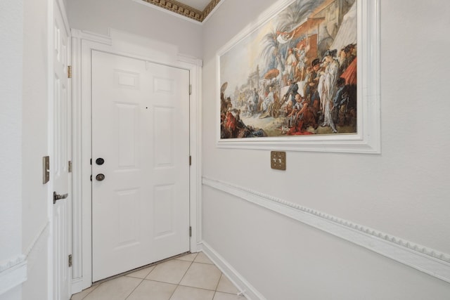 doorway with light tile patterned floors