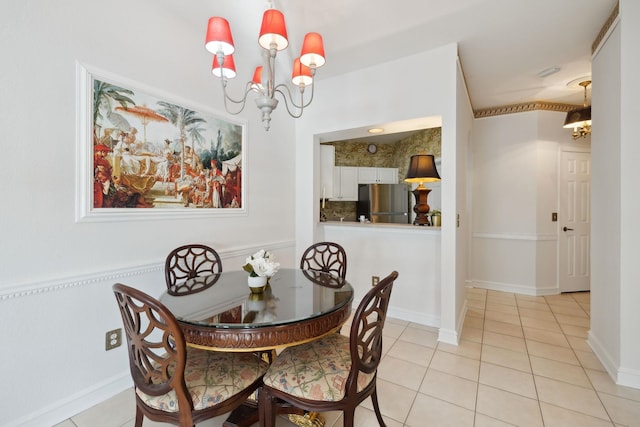 tiled dining space with an inviting chandelier